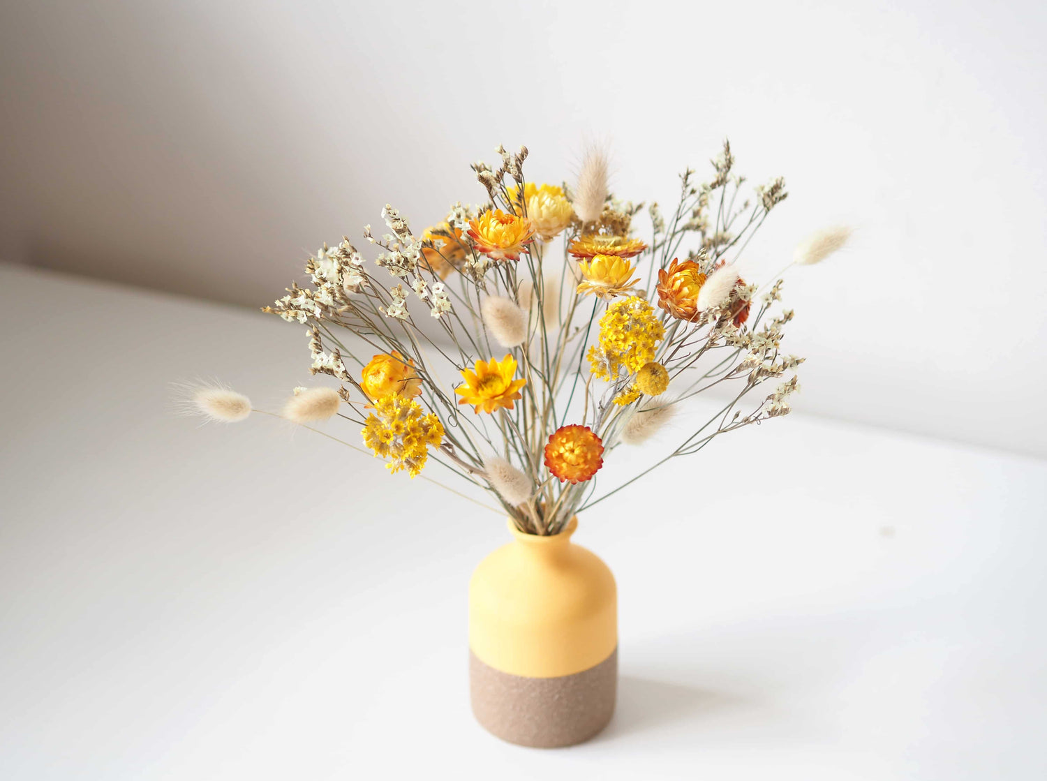 LULU - dried yellow strawflowers in a yellow vase